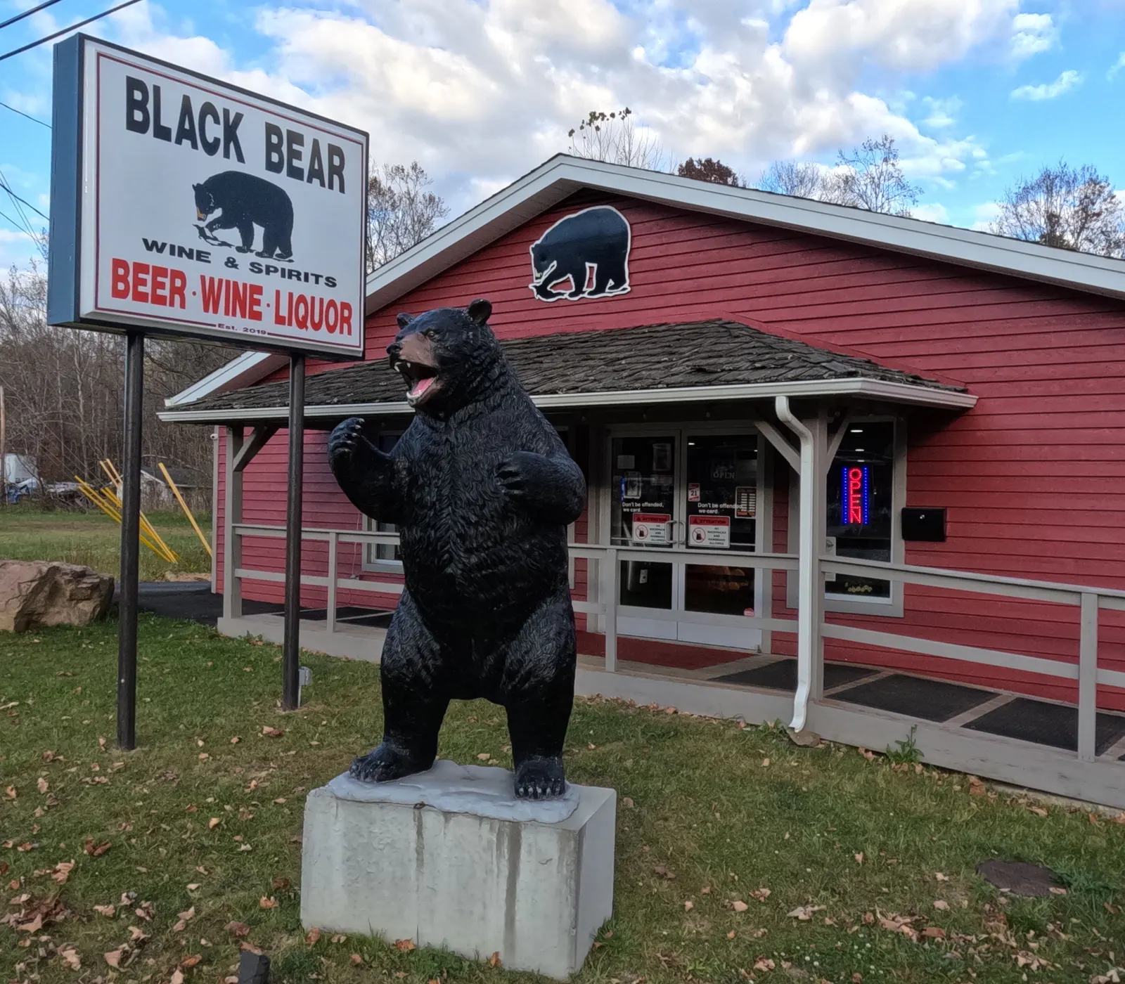 The black bear statue and the Black Bear Wine & Spirits sign